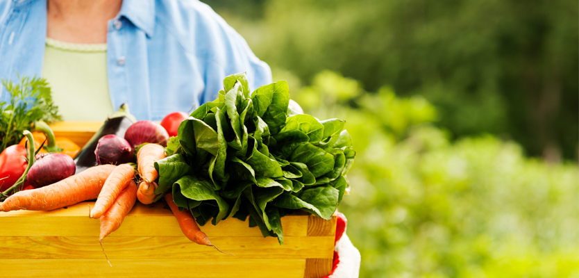 wooden crate of fresh garden vegetables